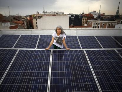 Montse Romanillos on the solar panel-covered roof of her building in Madrid.