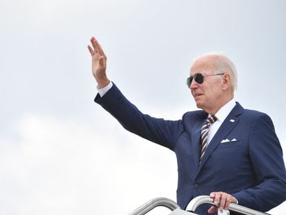 US President Joe Biden waves before boarding Air Force One on August 10.