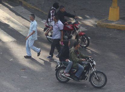 April 8: A group patrols Caracas, openly displaying its weapons.