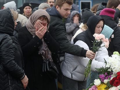 Russian citizens laid flowers in front of the concert venue in Moscow on Sunday.