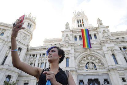 The gay pride flag hangs from Madrid City Hall.