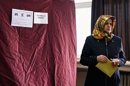 A woman attends voting at a polling station during the presidential and parliamentary elections, in Istanbul, Turkey May 14, 2023.