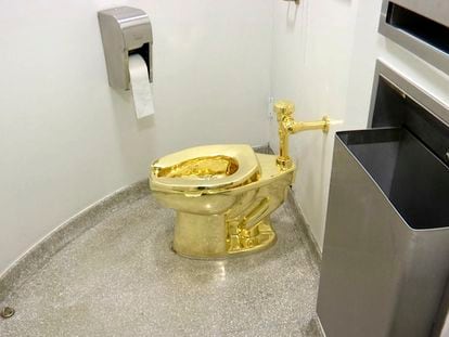 This Sept. 16, 2016 file image made from a video shows the 18-karat toilet, titled "America," by Maurizio Cattelan in the restroom of the Solomon R. Guggenheim Museum in New York.