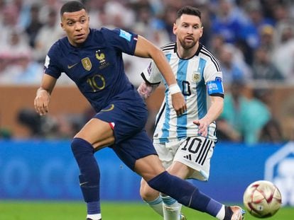France's Kylian Mbappe and Argentina's Lionel Messi go for the ball during the World Cup final soccer match at the Lusail Stadium in Lusail, Qatar, Sunday, Dec.18, 2022.