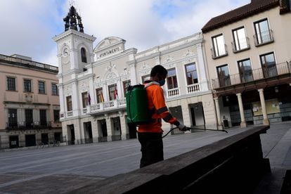 A worker disinfects a square in Guadalajara on Monday.