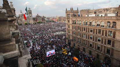 Supporters watch Mexico's President Andres Manuel Lopez Obrador on a screen as he delivers a speech during an event to mark the 85th anniversary of the expropriation of foreign oil firms, at the Zocalo square, in Mexico City, Mexico March 18, 2023.