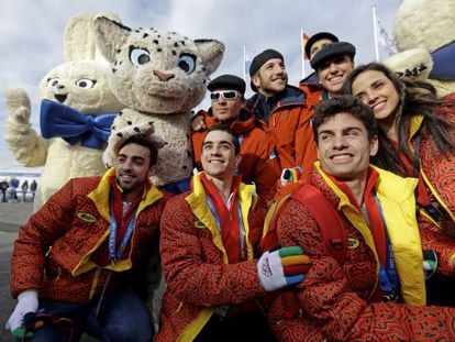Members of the Spain team pose for a picture with some mascots during a welcoming ceremony at the 2014 Winter Olympics. 