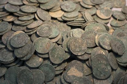 The bronze coins on a table at the Archeology Museum of Seville.