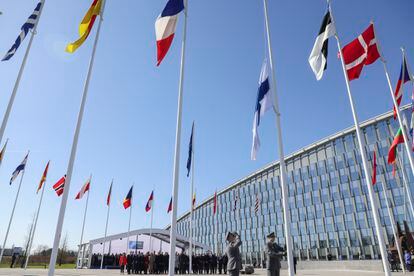 Military personnel raise the Finnish flag during a ceremony on the sidelines of a NATO foreign ministers meeting at NATO headquarters in Brussels, on April 4, 2023.