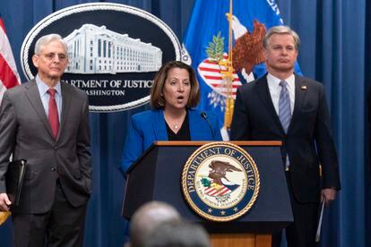 Deputy Attorney General Lisa Monaco flanked by Attorney General Merrick Garland, left, and Federal Bureau of Investigation (FBI) Director Christopher Wray speaks during a news conference to announce an international ransomware enforcement action, at the Department of Justice in Washington, Thursday, Jan. 26, 2023.