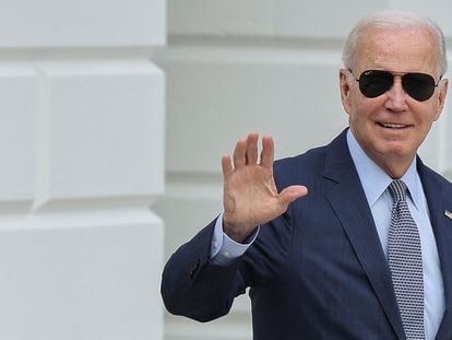 U.S. President Joe Biden waves as he walks to board Marine One for Delaware from the White House in Washington, U.S., August 11, 2023.