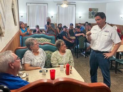 Republican presidential candidate Florida Gov. Ron DeSantis talks with diners at Vinton Family Restaurant in Vinton, Iowa, Saturday, Aug. 5, 2023.