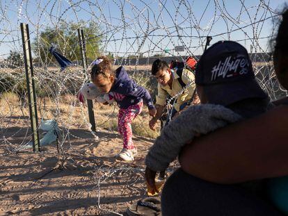 Immigrant families cross the border from Mexico into the U.S. to seek asylum, days before a health measure that facilitates quick removals expires Thursday.