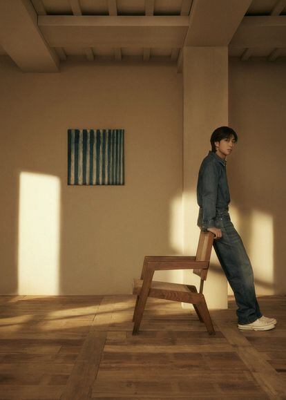 An image from 'Indigo,' RM's first solo album, showing Yun Hyong-keun's painting 'Blue' (1972) and a Chandigarh chair designed by Pierre Jeanneret.