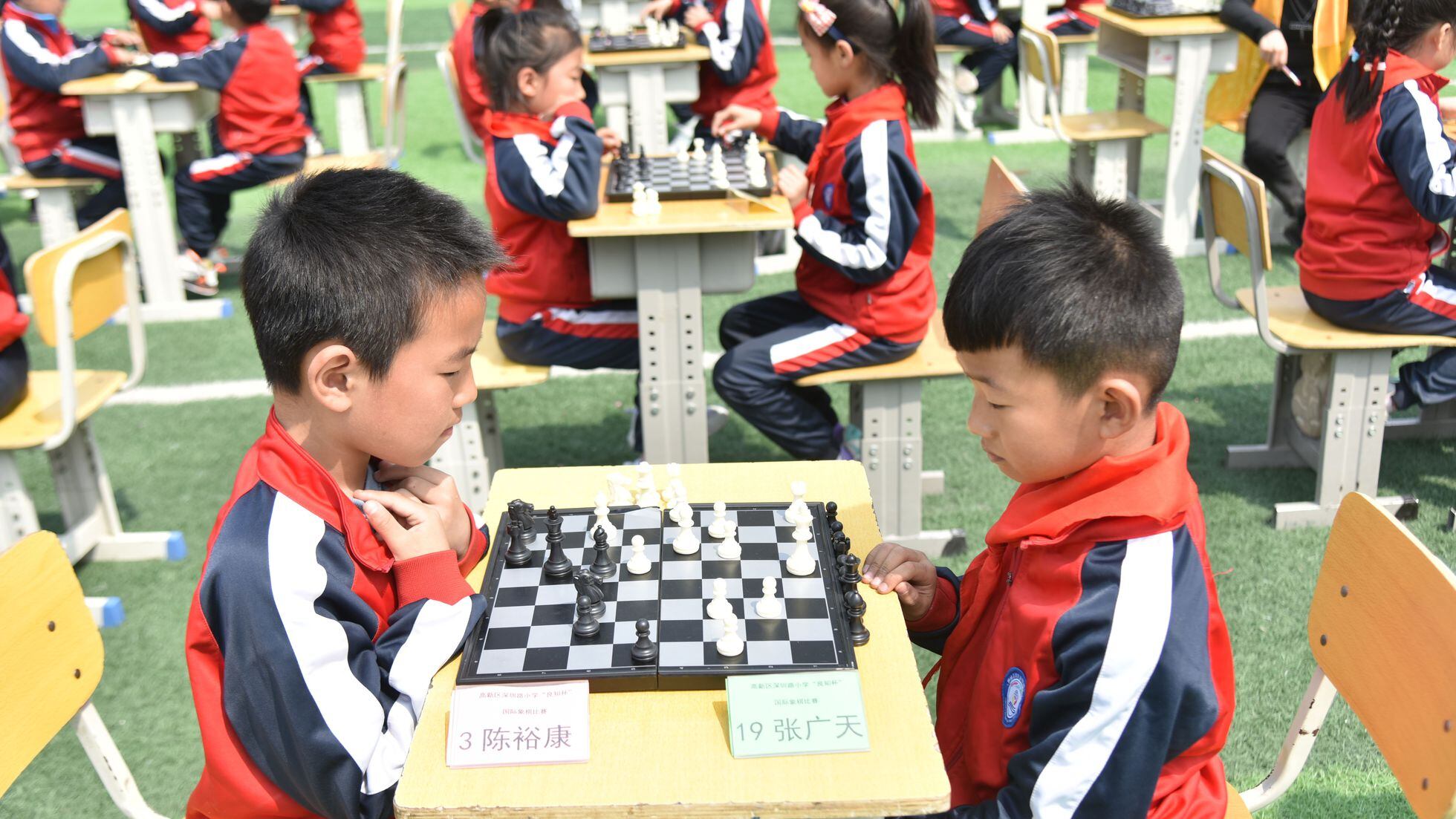 Boys play chess with a clock to control time Vector Image