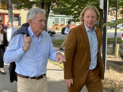 Federal Reserve Chair Jerome Powell, left, and Kevin Schreiber, CEO of the York County Economic Alliance, walk in York, Pa. on Monday, Oct. 2, 2023