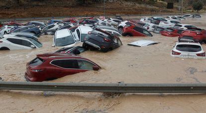 Dozens of cars partially submerged in a vehicle depot in Orihuela (Alicante).