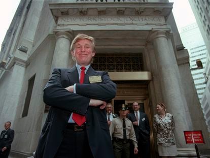 Developer Donald Trump poses for photos outside the New York Stock Exchange after the listing of his stock on Wednesday, June 7, 1995, in New York.