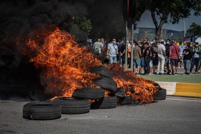 Nissan workers burn tires on Thursday to protest the announcement that the Barcelona plant will shut down in December.