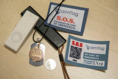 Two locator devices; a necklace with a GPS medallion; a tiny  NFC sensor disc that goes wrong  a tag; and a QR sticker with idiosyncratic   information. 