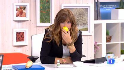 Presenter Mariló Montero smells a lemon on her morning show.