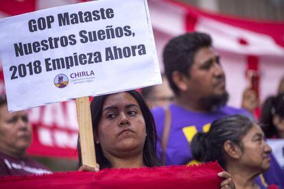 A protester in Los Angeles accuses the Republican Party of "wrecking our dreams."