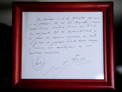 A framed copy of the napkin linking the 13-year-old Lionel Messi to FC Barcelona is seen in Barcelona, Spain on Jan. 5, 2012.