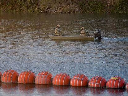 Army National Guard soldiers patrol the banks of the Rio Grande at a crossing point for migrants at the U.S.-Mexico border in Eagle Pass, Texas, U.S., January 9, 2024.