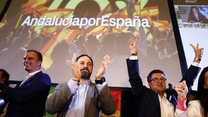 VOX party leader Santiago Abascal (center) and aides celebrate the election results.