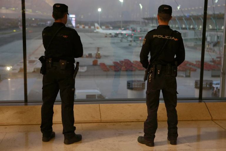 Police officers at Madrid’s Adolfo Suárez-Barajas airport.