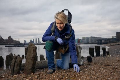 The 'mudlarker' Lara Maiklem searching the banks of the Thames near Greenwich, in a photograph provided by the publisher.
