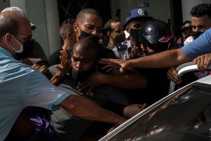 Police detain a protestor in Havana on Sunday. 