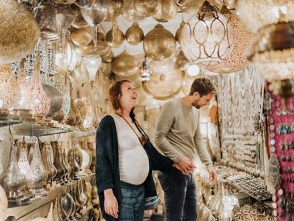 The term 'babymoon' alludes to the honeymoon. Pictured here, a couple visits a souk in Marrakesh, Morocco.
