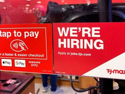 A hiring sign is displayed at a retail store in Mount Prospect, Ill., Friday, Jan. 13, 2023.