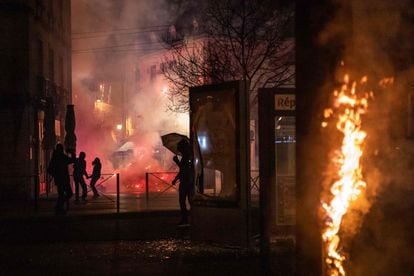 Demonstrators face French police during a demonstration in Dijon, central France, March 20, 2023.
