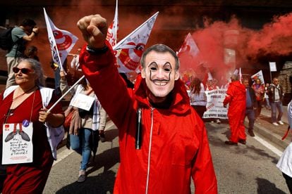A protester, wearing a mask depicting French President Emmanuel Macron, in Nice on March 23.