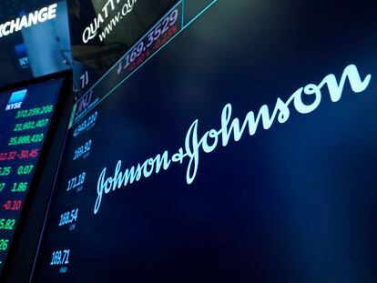 The Johnson & Johnson logo appears above a trading post on the floor of the New York Stock Exchange, on July 12, 2021.