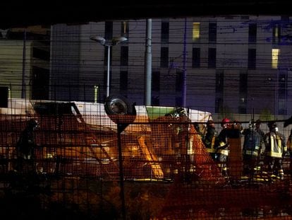 Rescue personnel work at the site where a passenger bus with people on board fell from an elevated section ending up on the railway track that runs alongside the road in Mestre, near Venice, Italy, 03 October 2023.