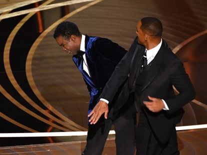Will Smith (right) slaps Chris Rock onstage during the 94th Oscars at the Dolby Theatre in Hollywood, California, on March 27, 2022.