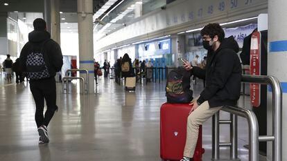 A traveler at a bus station in Madrid.