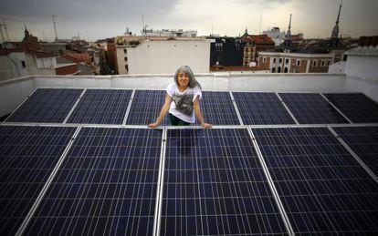 Montse Romanillos on the solar panel-covered roof of her building in Madrid.