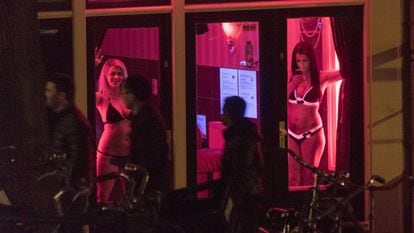 Sex workers in Amsterdam's red light district.