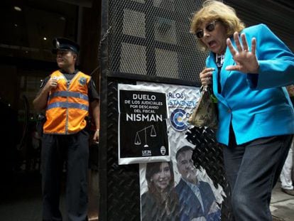 A woman passes the office of prosecutor Viviana Fein.