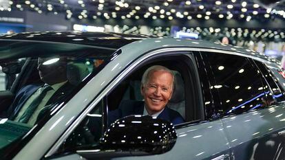 President Joe Biden drives a Cadillac Lyriq through the show room during a tour at the Detroit Auto Show, Sept. 14, 2022, in Detroit.