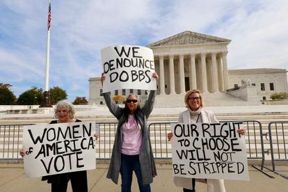 Three women protested before the Supreme Court on November 2.
