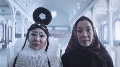 Stephanie Hsu – with the bagel on her head – and Michelle Yeoh, in one of the parallel universes of 'Everything Everywhere All at Once.'