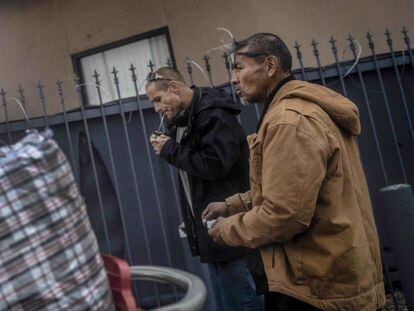 A man smokes fentanyl on the streets of Albuquerque, New Mexico, in December 2021.