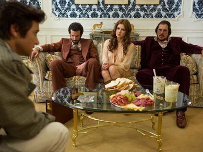 From left: Jeremy Renner, Bradley Cooper, Amy Adams and Christian Bale in American Hustle.