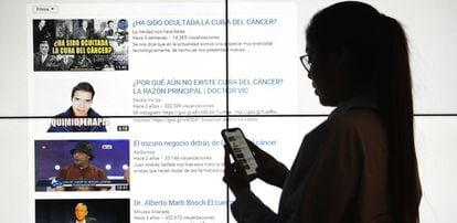 A woman does a YouTube search for cancer cures.