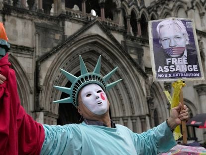 A demonstrator dressed as the Statue of Liberty protests outside the High Court of Justice on February 21 in London.